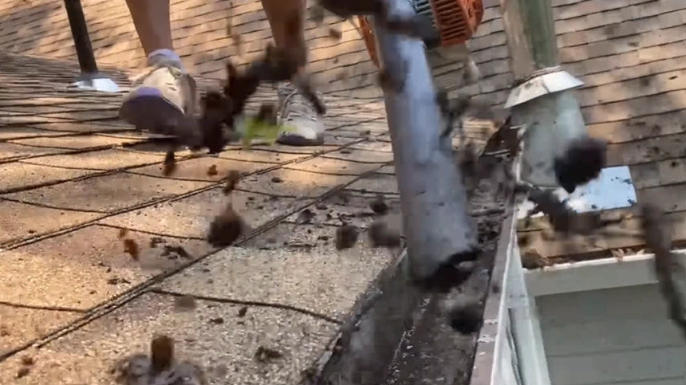 Blowing debris out of gutter
