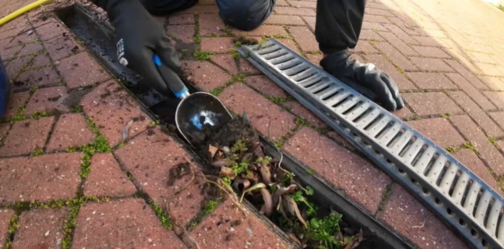 Cleaning drain channel debris