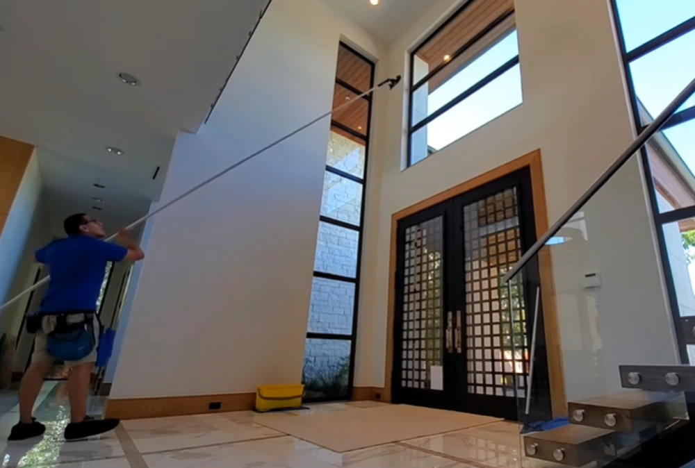 Window cleaning Santa Cruz: cleaning high entryway windows pole