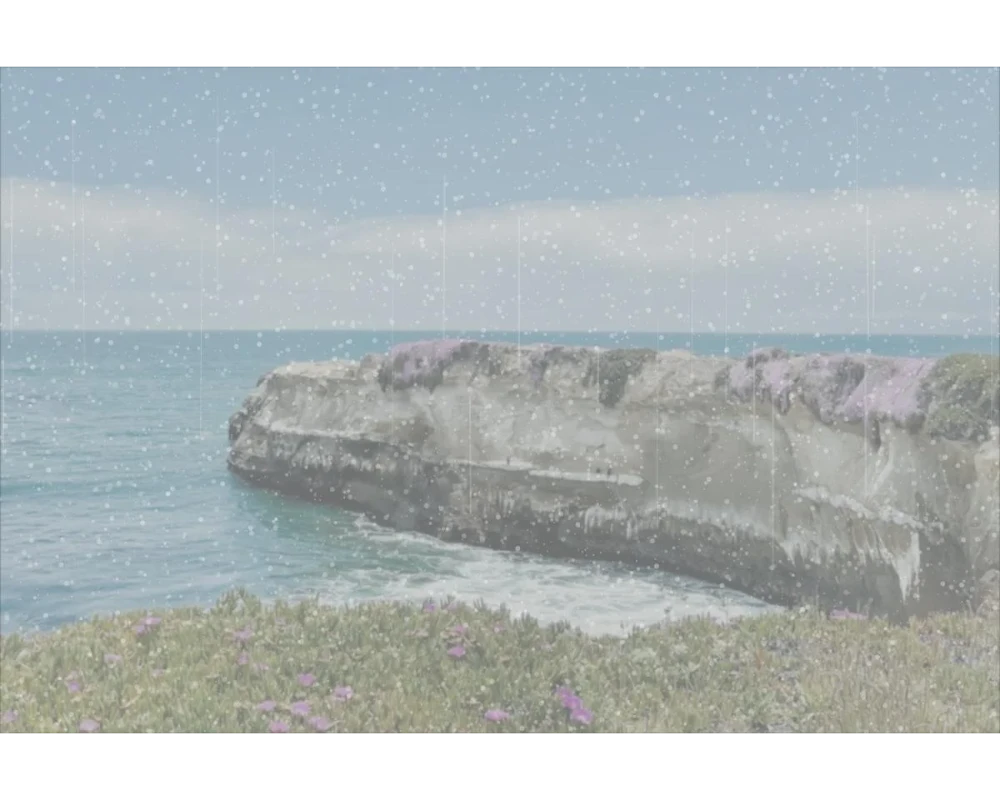 Ocean view through hazy, mineral-spotted glass
