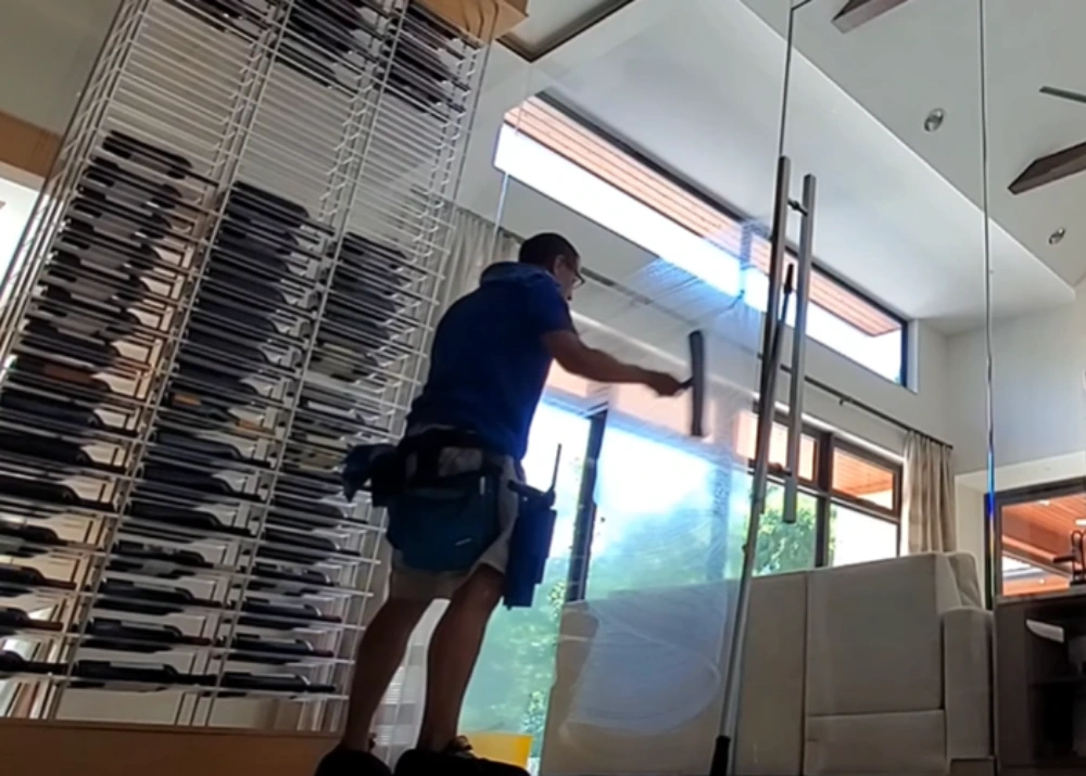 Window cleaning Santa Cruz: interior glass wall squeegee pull