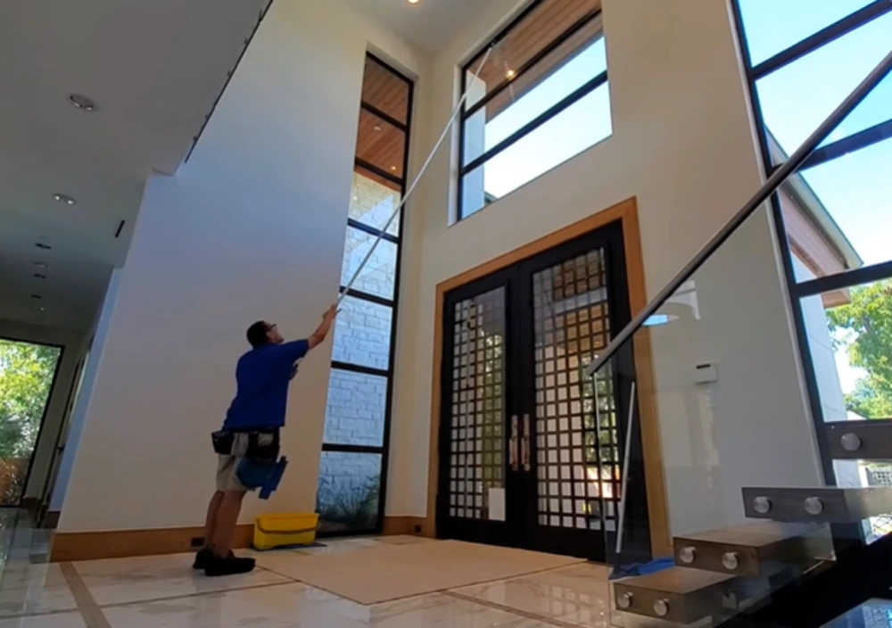 Window cleaning Santa Cruz: pole scrubbing tall foyer window