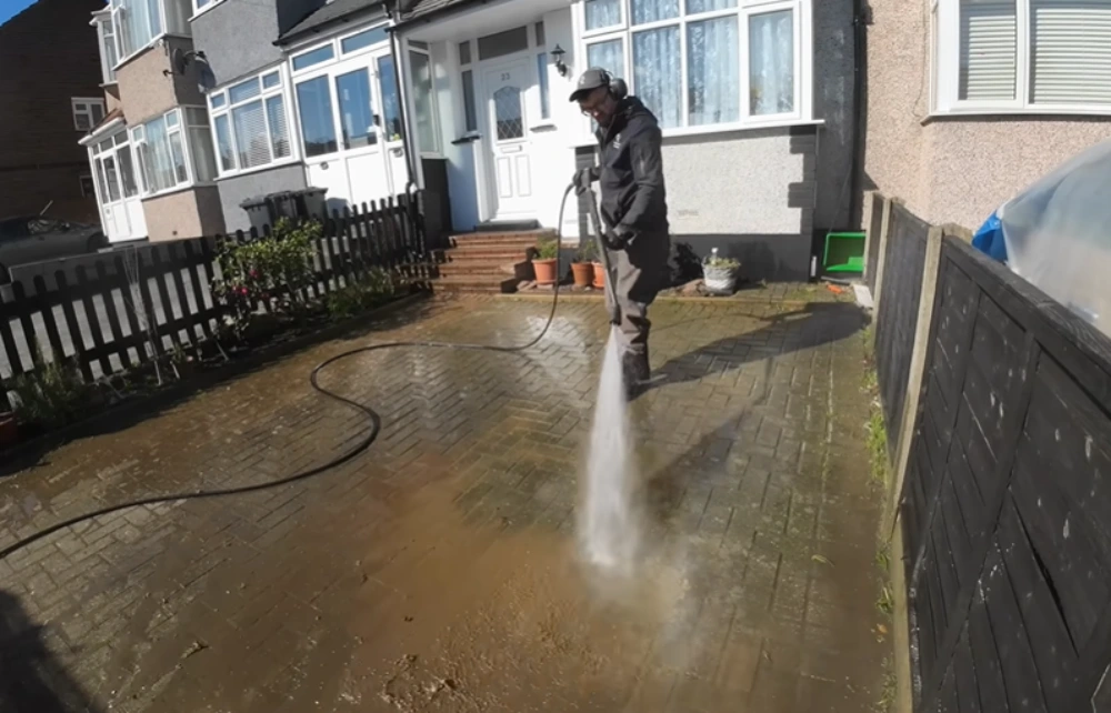Pressure washing front patio pavers