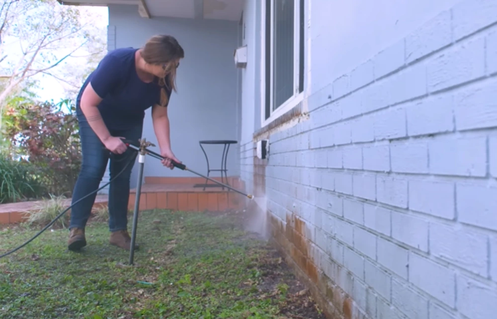 Pressure washing lower wall stains