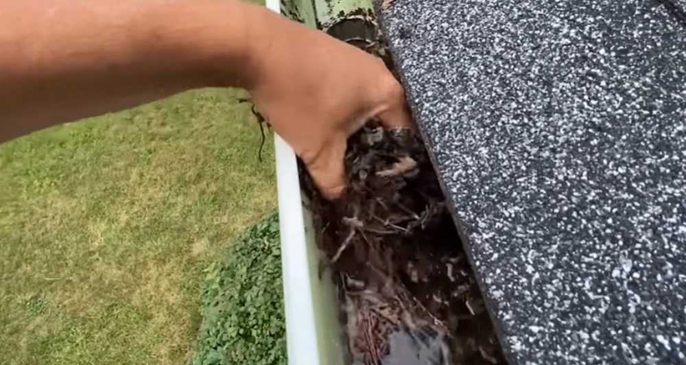 Removing wet debris from gutter