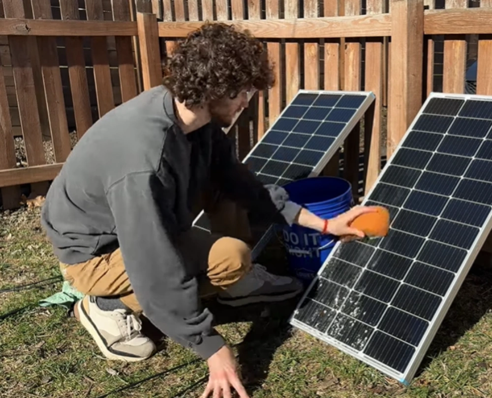 Scrubbing solar panel with sponge