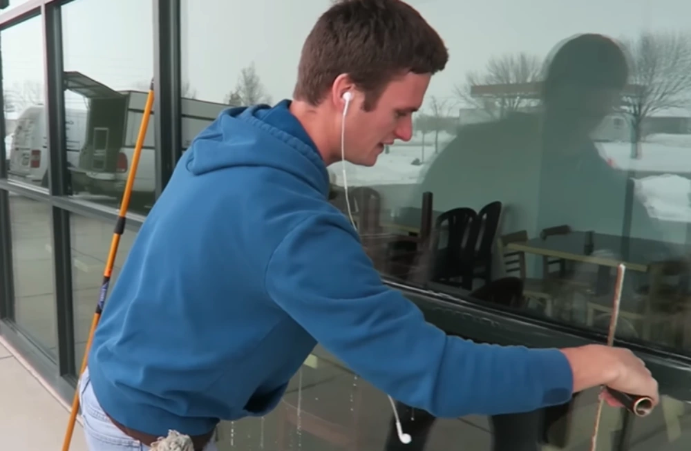 Squeegee bottom edge window cleaning