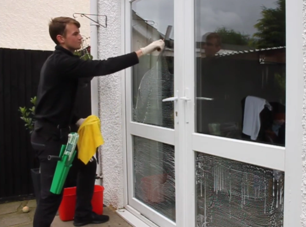 Squeegee on the upper pane of a patio door