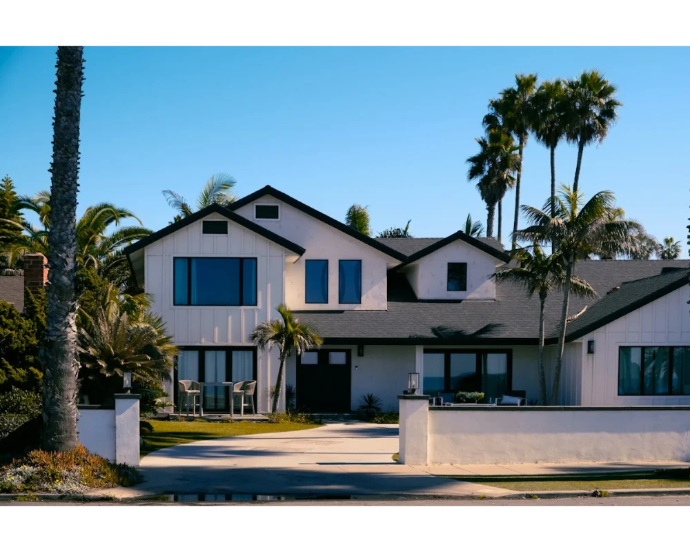 Two-story home with large windows