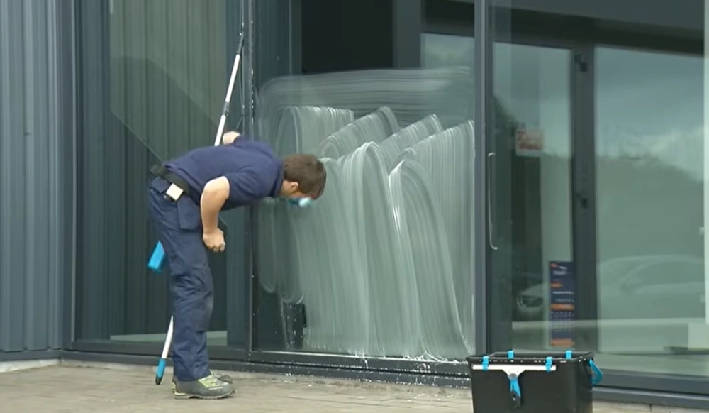 Washing commercial storefront glass wall