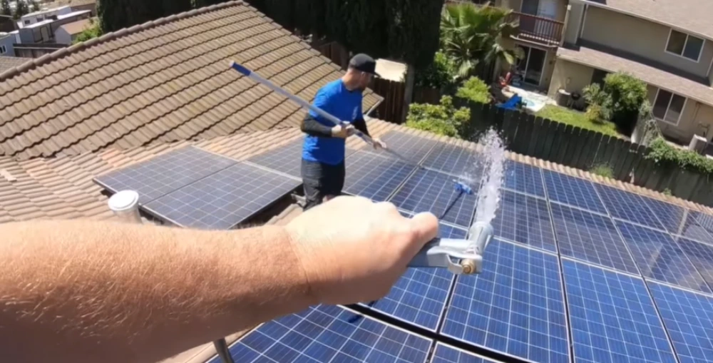Water-fed brush solar array tile roof