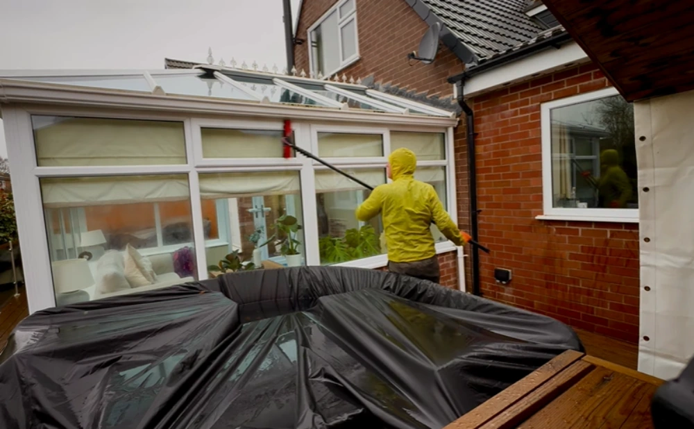 Water-fed pole cleaning conservatory windows