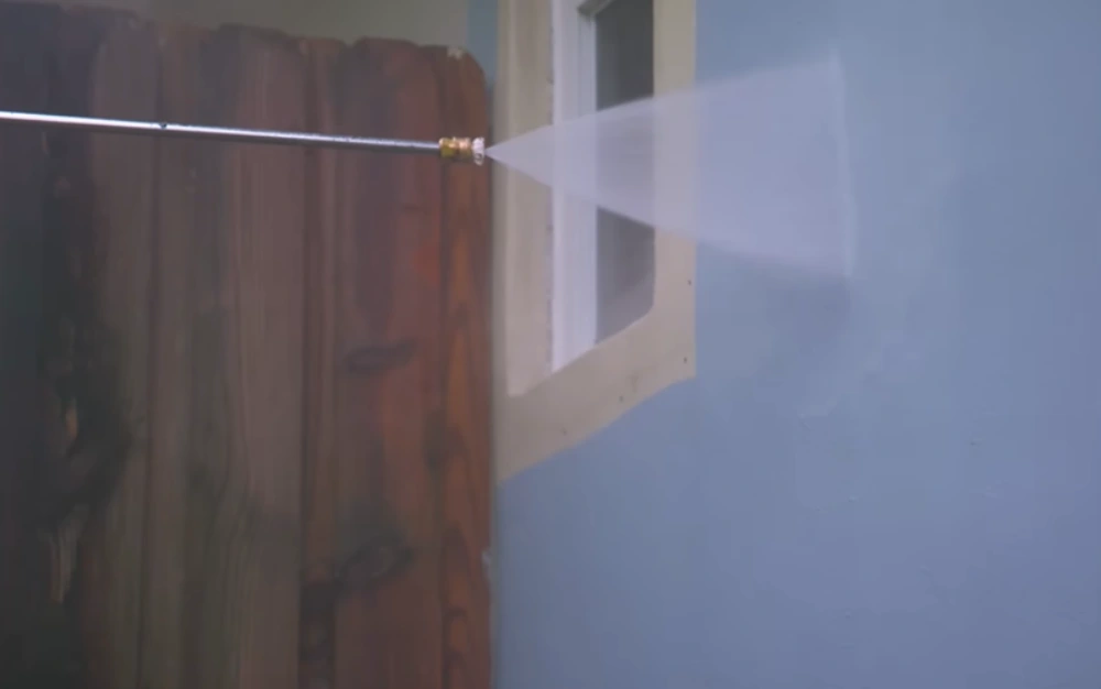 Wide spray washing house wall