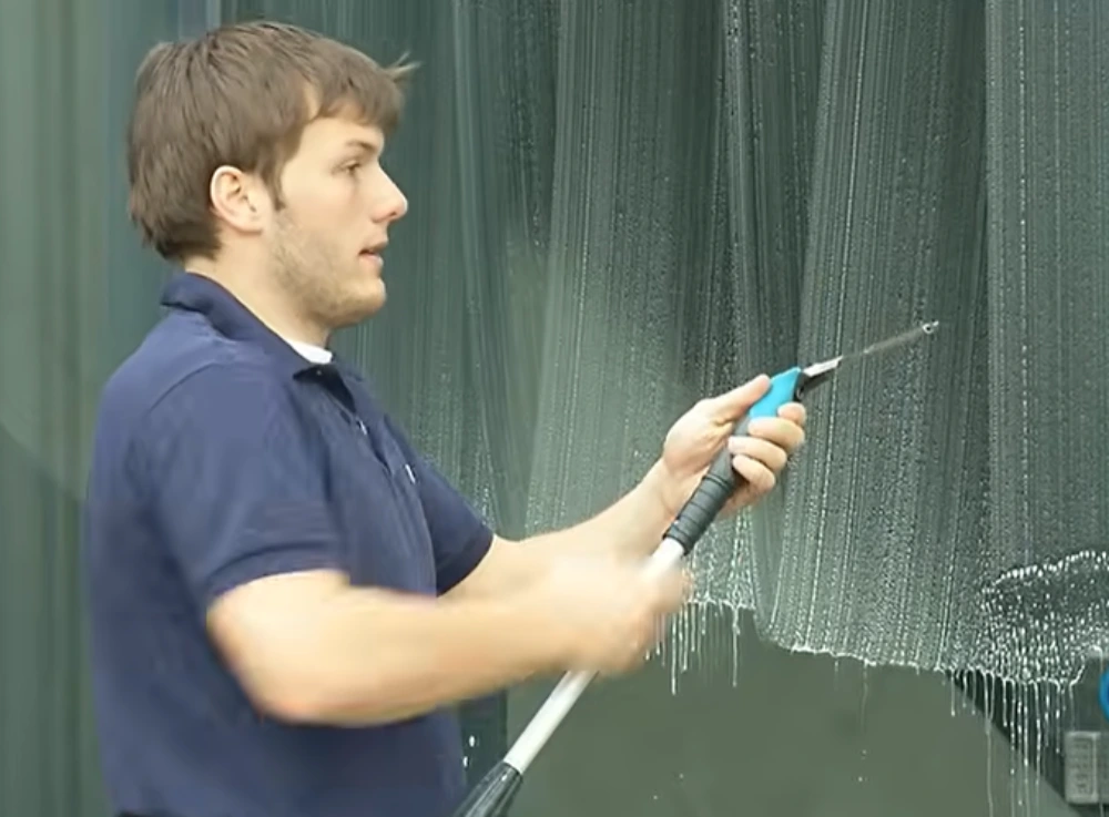 Window cleaner washing commercial glass pole