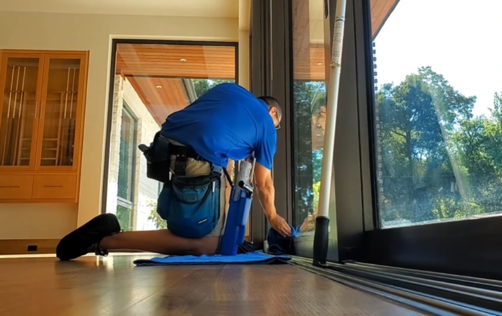 Window cleaning Santa Cruz: wiping sliding door track and sill
